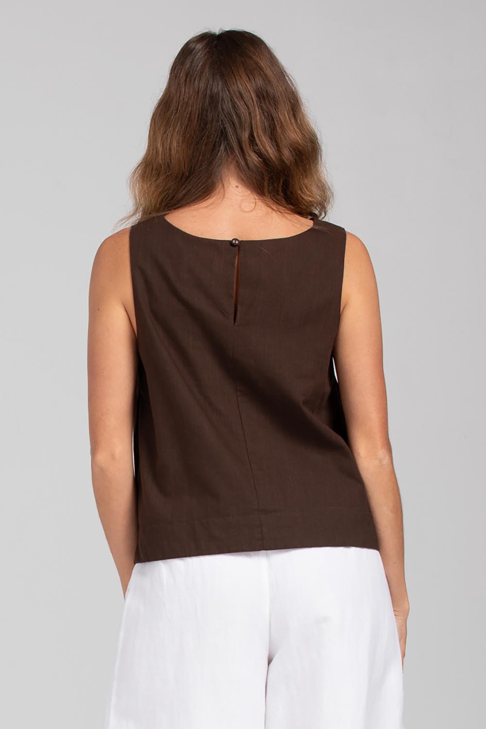 A model wearing the Hara Cotton Top in colour Coffee, from the back