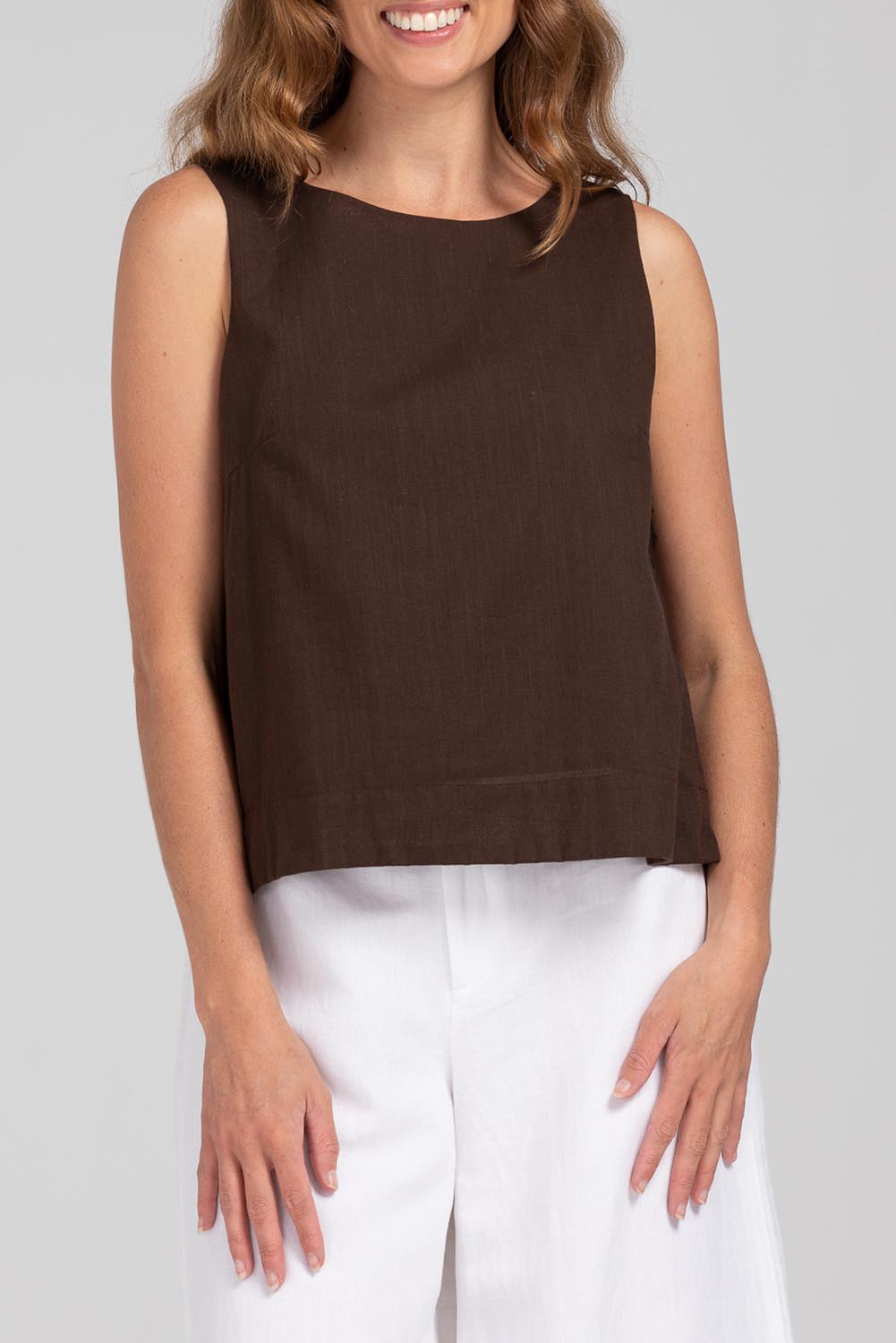 A model wearing the Hara Cotton Top in colour Coffee, from the front, cropped image