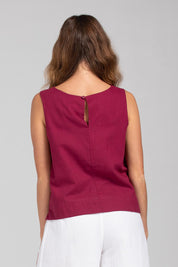 A model wearing the Hara Cotton Top in colour Magenta (Purple), from the back