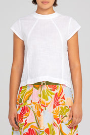 A model wearing the Leaf Cotton Top in colour White (White), from the front, cropped image