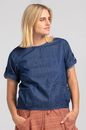 A model wearing the Guru Denim Top in colour Darkdenim (Blue), from the front, cropped image