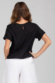 A model wearing the Guru Cotton Top in colour Black (Black), from the back