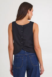 Model Madeline wearing size 10 of the Rose Linen Top in colour Black (Black), from the back