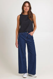 Model Madeline wearing size 10 of the Rose Linen Top in colour Black (Black), from the front, showing the whole outfit