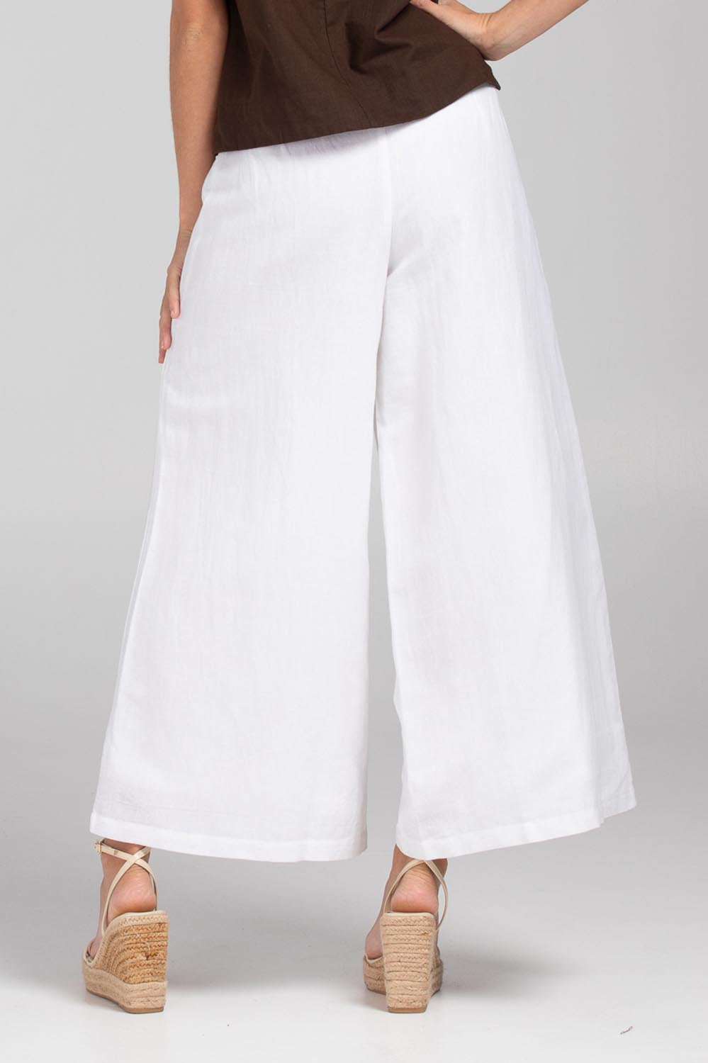 A model wearing the Jedda Linen Cotton Pant in colour White (White), from the back
