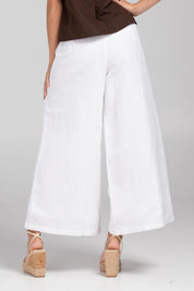 A model wearing the Jedda Linen Cotton Pant in colour White (White), from the back