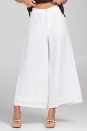 A model wearing the Jedda Linen Cotton Pant in colour White (White), from the front, cropped image