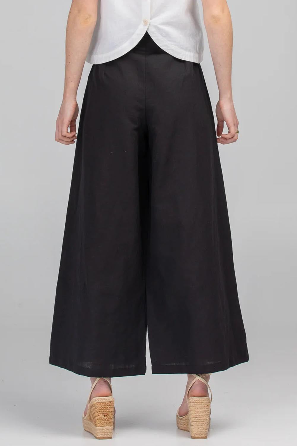 A model wearing the Jedda Linen Cotton Pant in colour Black (Black), from the back
