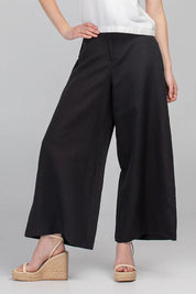 A model wearing the Jedda Linen Cotton Pant in colour Black (Black), from the front, cropped image