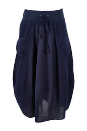 Product shot of the Guru Skirt in colour Navy (Blue), from the front