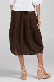 A model wearing the Guru Cotton Skirt in colour Coffee, from the back