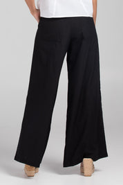 A model wearing the Luca Cotton Pant in colour Black (Black), from the back