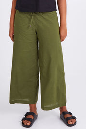 Model Olivia wearing size 10 of the Ria Pant in colour Khaki (Green), from the front, cropped image