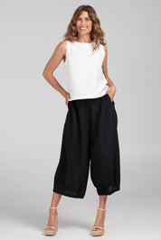A model wearing the Zetta Cotton Pant in colour Black (Black), from the front, showing the whole outfit