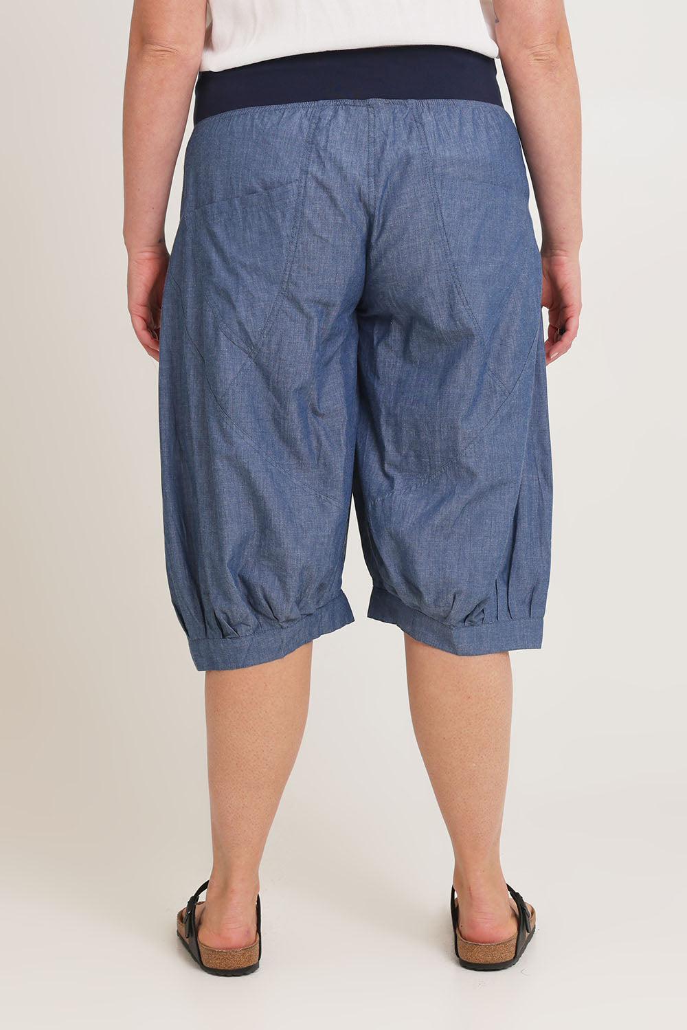 Model Chanel wearing size 16 of the Jada Short in colour Chambray (Blue), from the back