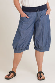 Model Chanel wearing size 16 of the Jada Short in colour Chambray (Blue), from the front, cropped image