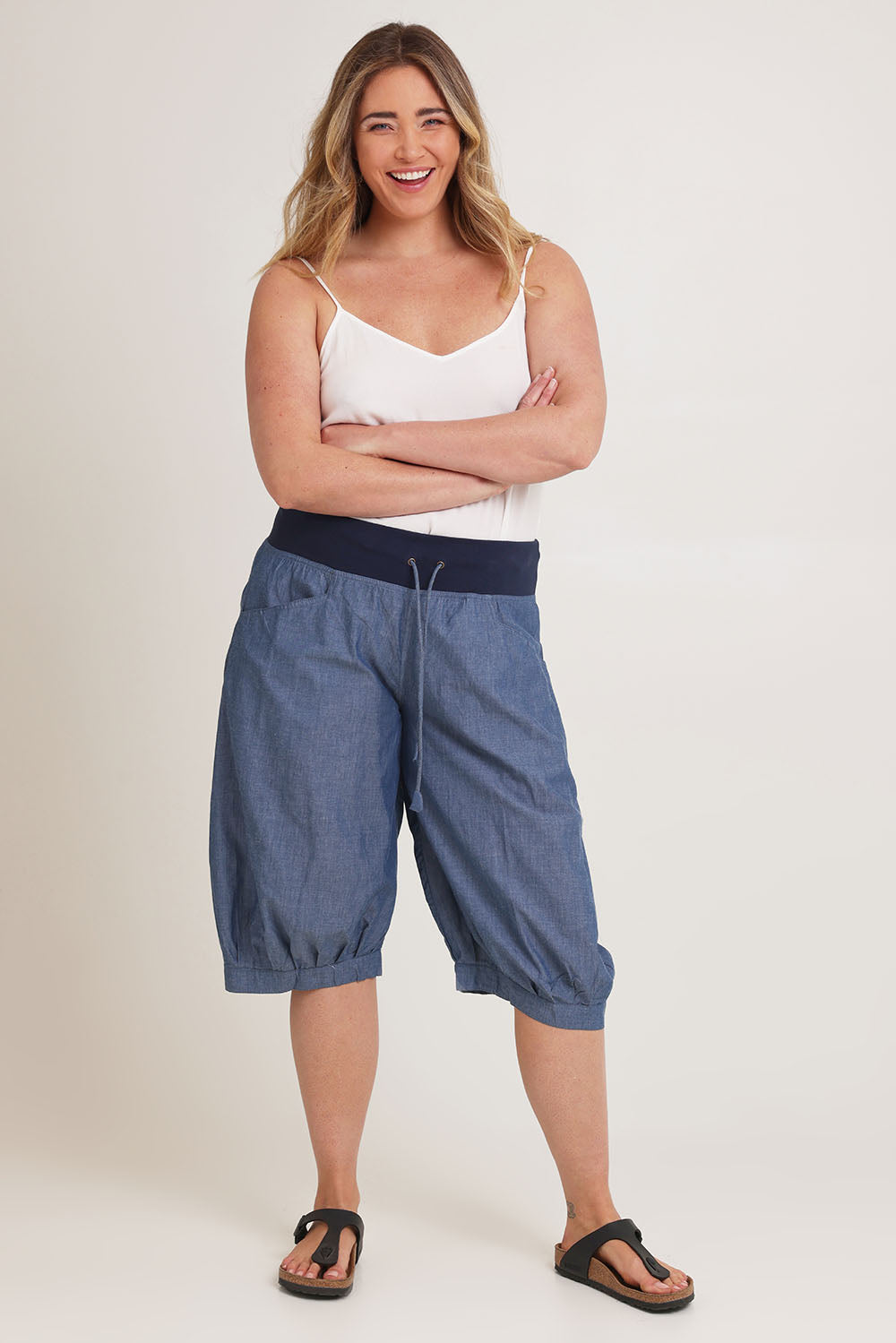 Model Chanel wearing size 16 of the Jada Short in colour Chambray (Blue), from the front, showing the whole outfit
