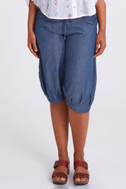 Model Olivia wearing size 10 of the Jada Short in colour Chambray (Blue), from the front, cropped image