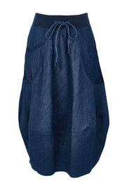 Product shot of the Guru Denim Skirt in colour Darkdenim (Blue), from the front