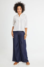 Model Olivia wearing size 10 of the Maahee Shirt in colour White (White), from the front, showing the whole outfit