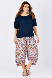 Model Laura wearing size 12 of the Bliss Top Basics in colour BlueBasic (Blue), from the front, showing the whole outfit