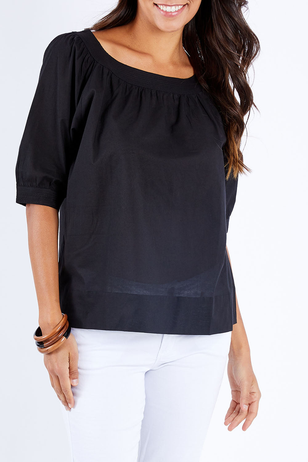 Model Vitoria wearing size 10 of the Bliss Top in colour Black (Black), from the front, cropped image