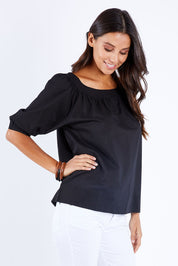 Model Vitoria wearing size 10 of the Bliss Top in colour Black (Black), from the front, cropped image