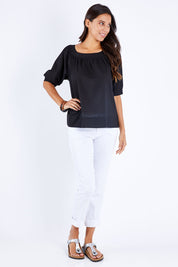 Model Vitoria wearing size 10 of the Bliss Top in colour Black (Black), from the front, showing the whole outfit
