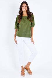 Model Vitoria wearing size 10 of the Bliss Top in colour Khaki (Blue), from the front, showing the whole outfit