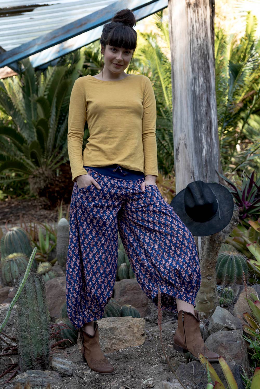 A model wearing the Printed Guru Pants in colour Blue (Blue), from the front, showing the whole outfit