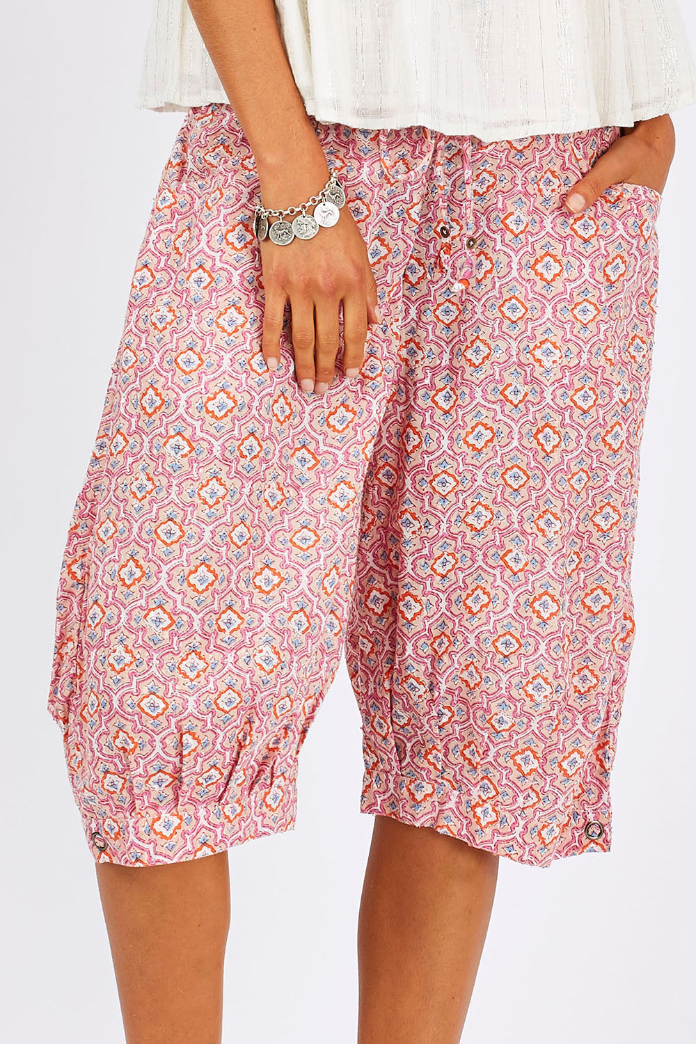 Model Nikki wearing size 10 of the Jada Short in colour RoseTile (Pink), from the front, cropped image