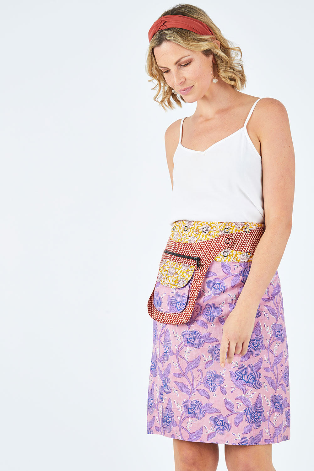 Model Chelsea wearing size OneSize of the Rosanna Long Skirt in colour Amberzep, from the front, cropped image