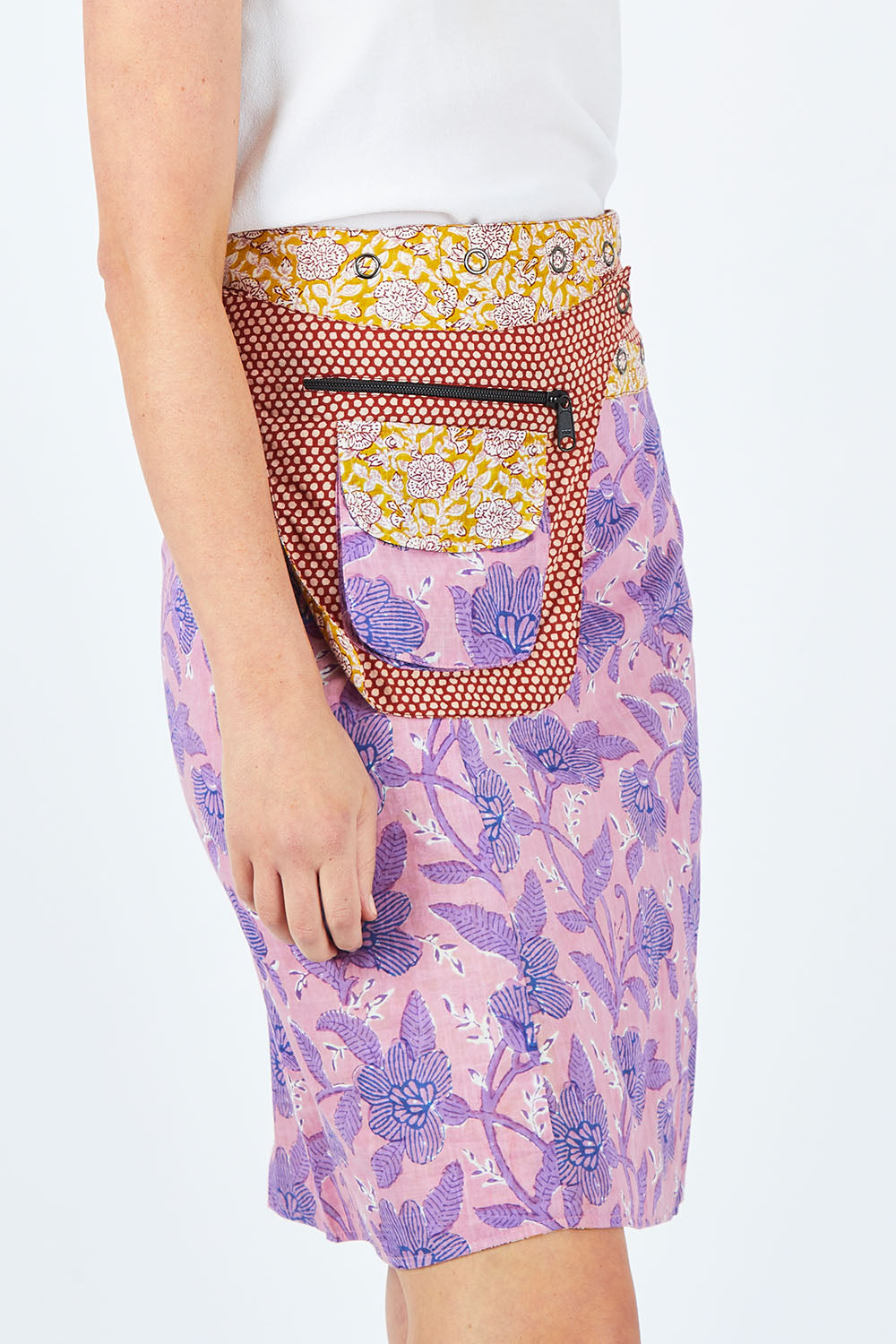 Model Chelsea wearing size OneSize of the Rosanna Long Skirt in colour Amberzep, from the front, cropped image