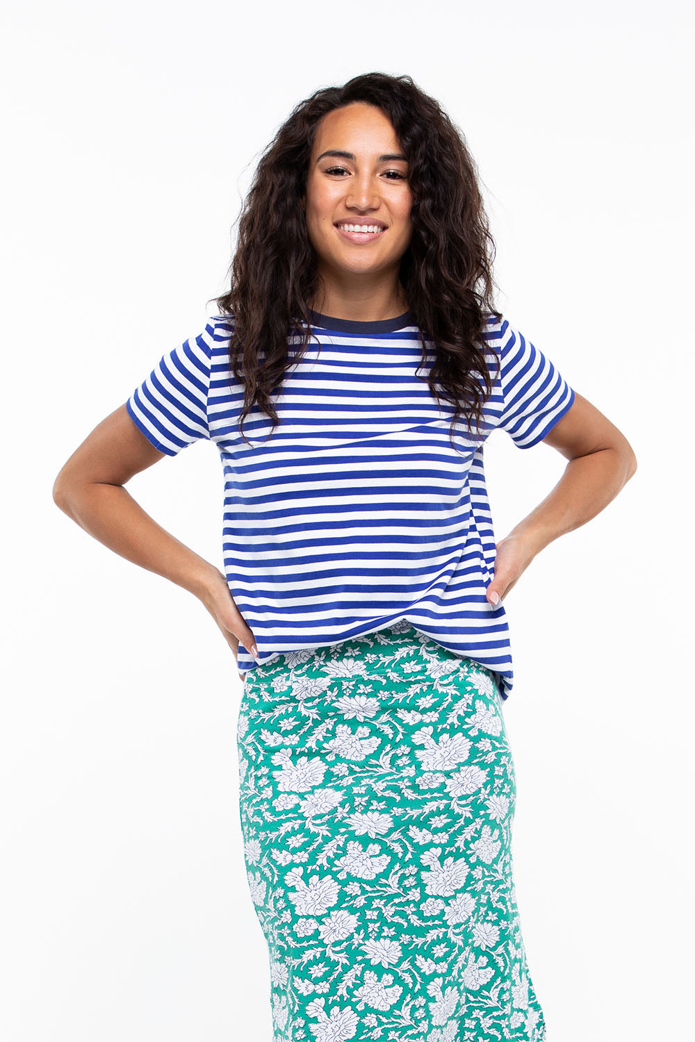 A model wearing the Pacifica Tee in colour Reefstripe (Blue), from the front, cropped image