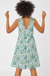 Model Olivia wearing size 10 of the Lodhi Dress in colour Lodhi (Green), from the back