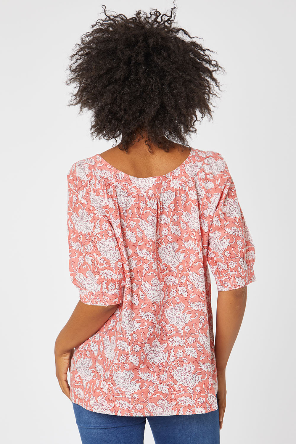 Model Olivia wearing size 10 of the Bliss Top in colour Moonga (Pink), from the back