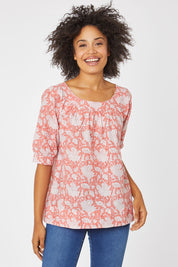 Model Olivia wearing size 10 of the Bliss Top in colour Moonga (Pink), from the front, cropped image