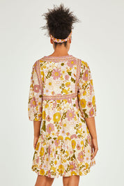 Model Olivia wearing size 10 of the Aurelia Dress in colour Aurelia (Pink), from the back