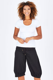 Model Summer wearing size 10 of the Jada Short in colour Black (Black), from the front, cropped image