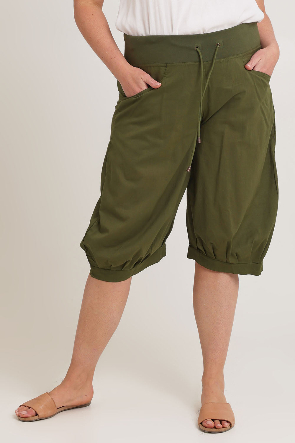 Model Chanel wearing size 16 of the Jada Short in colour Khaki (Green), from the front, cropped image