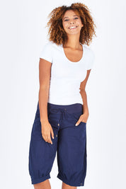 Model Summer wearing size 10 of the Jada Short in colour Navy (Blue), from the front, cropped image