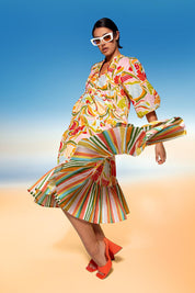 A model wearing the Mabel Cotton Dress in colour Colada (Green), from the front, showing the whole outfit