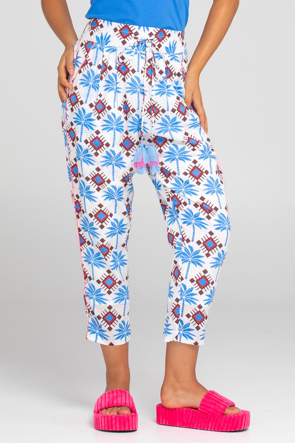 A model wearing the Lodhi Modal Pant in colour Malu (Blue), from the front, cropped image