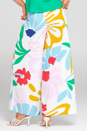 A model wearing the Harper Cotton Pant in colour Sachi (Pink), from the back