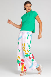 A model wearing the Harper Cotton Pant in colour Sachi (Pink), from the front, showing the whole outfit
