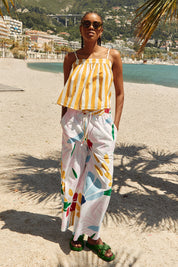 A model wearing the Harper Cotton Pant in colour Sachi (Pink), from the front, showing the whole outfit