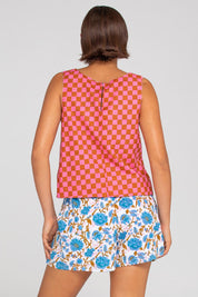 A model wearing the Daisy Cotton Short in colour Splicemaui (Blue), from the back