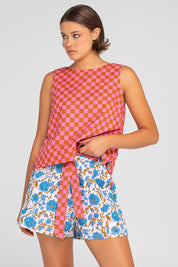 A model wearing the Daisy Cotton Short in colour Splicemaui (Blue), from the front, cropped image