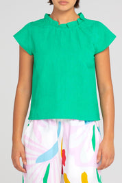 A model wearing the Sand Linen Cotton Top in colour Green (Green), from the front, cropped image