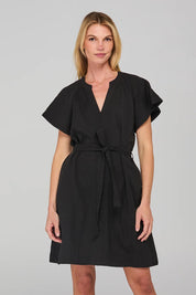 A model wearing the Livy Cotton Dress in colour Black (Black), from the front, cropped image